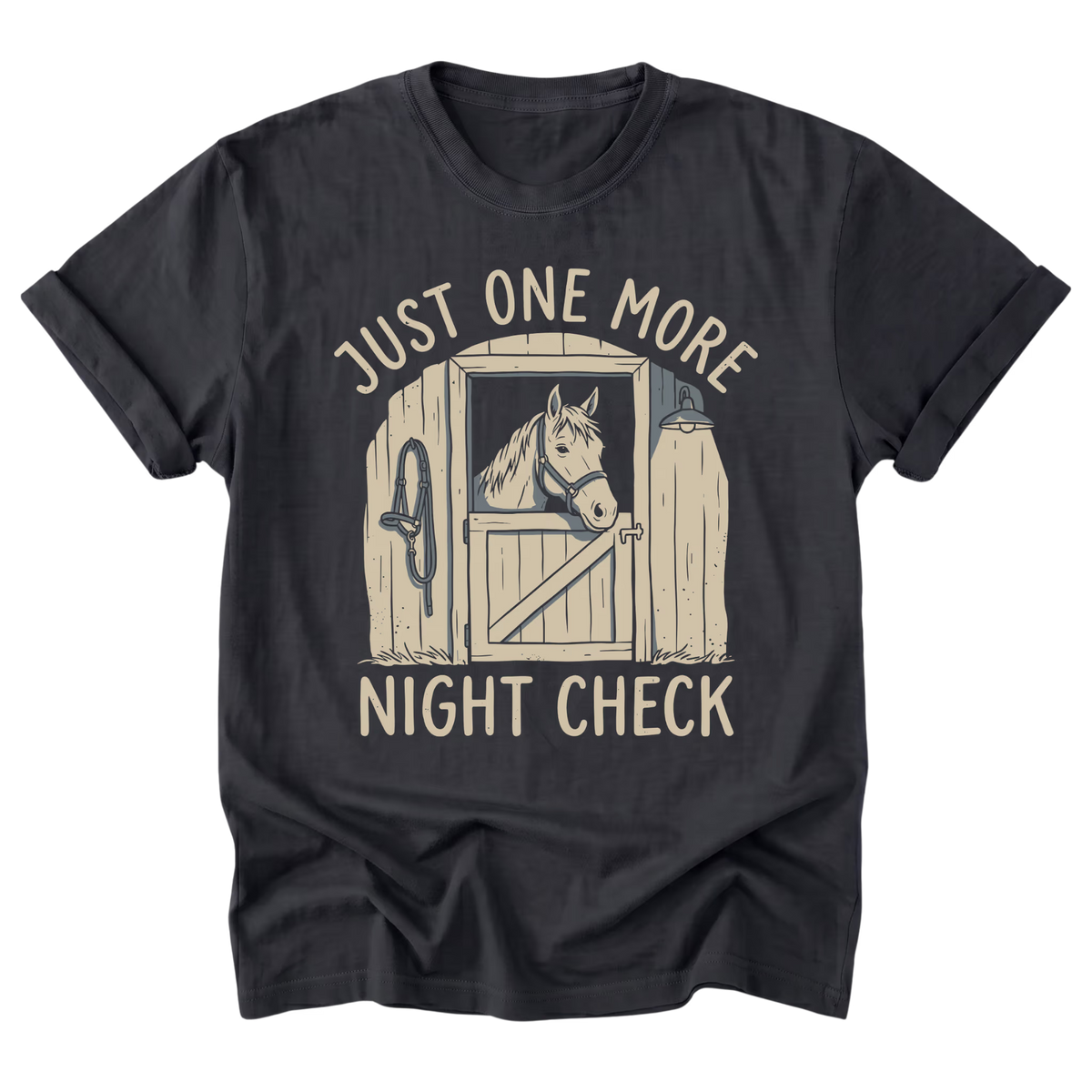 A black t-shirt with a vintage-style graphic of a horse in a stable door, accompanied by the text 'JUST ONE MORE NIGHT CHECK' in a light beige font.