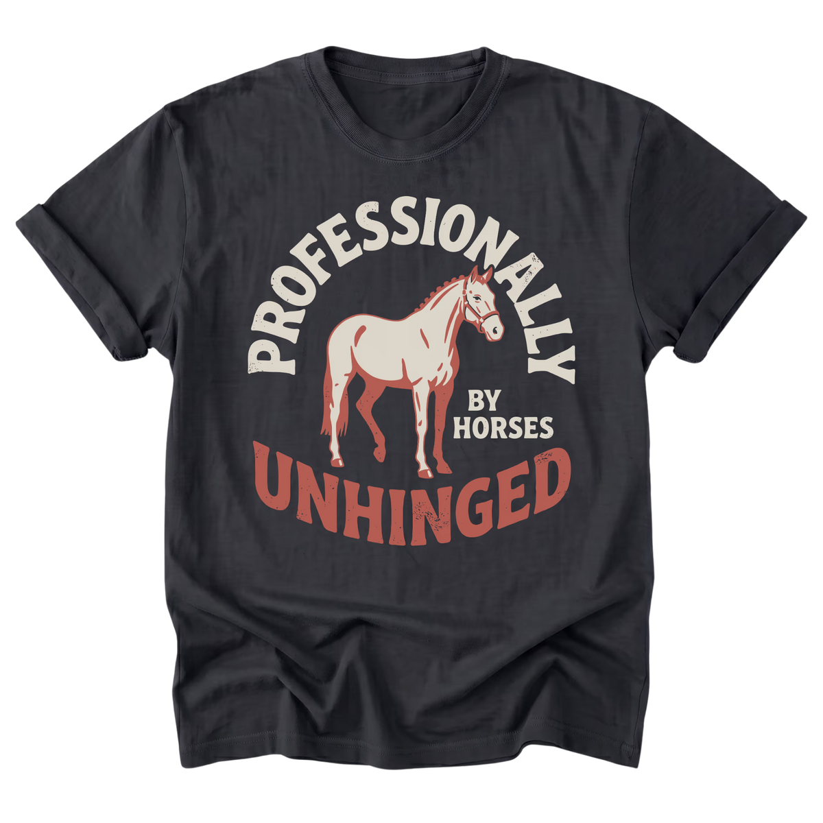 A black t-shirt with a vintage-style graphic print featuring a light-colored horse and the text 'PROFESSIONALLY UNHINGED BY HORSES' in cream and rust-red tones.