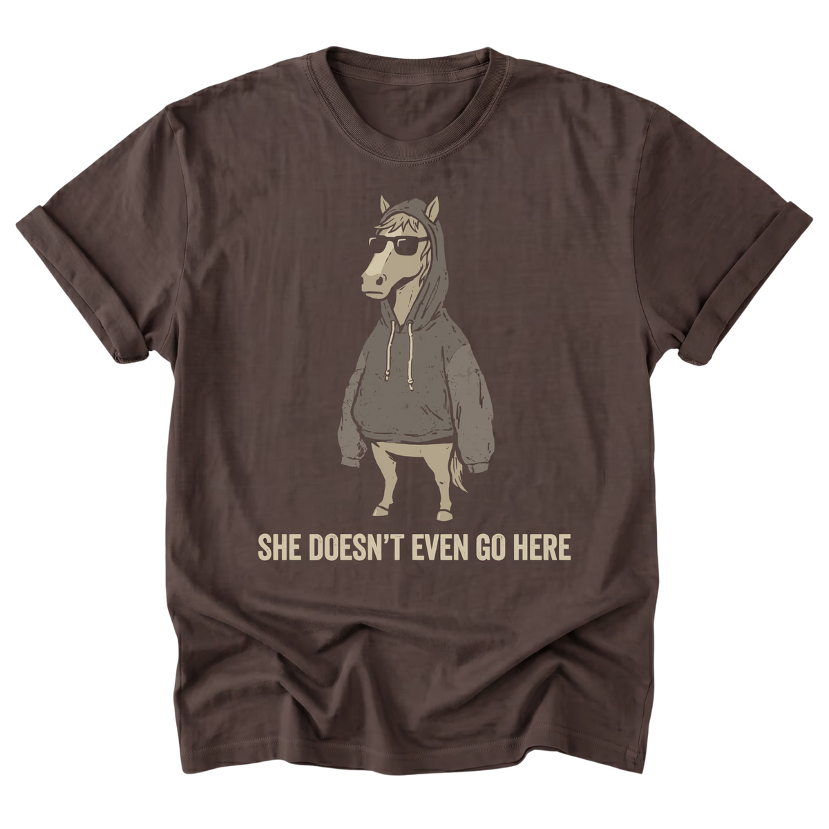 A dark chocolate brown graphic t-shirt of a horse wearing a hoodies and sunglasses with the text "She Doesn't Even Go Here" at the bottom
