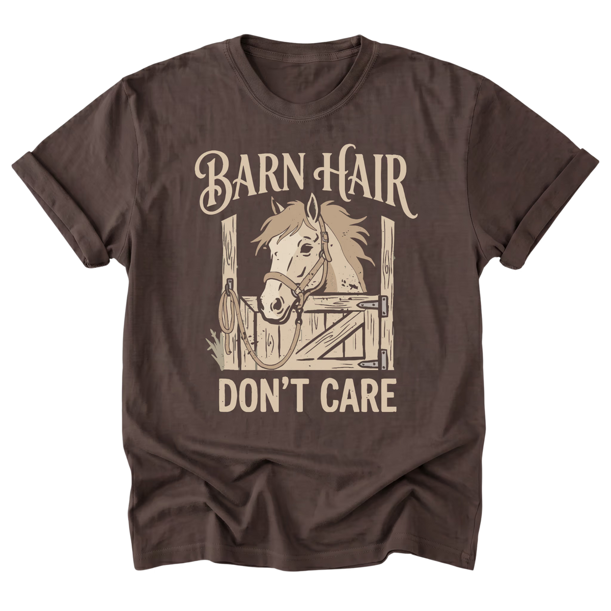 A dark brown short-sleeve t-shirt with a graphic print of a horse in a stable and the text 'BARN HAIR DON'T CARE' in a light beige color, displayed on a solid white background.
