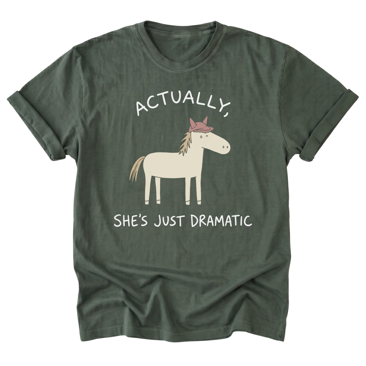 A military green short-sleeve t-shirt with a graphic of a cartoon horse wearing a pink crown, accompanied by the text 'ACTUALLY, SHE'S JUST DRAMATIC' in white.