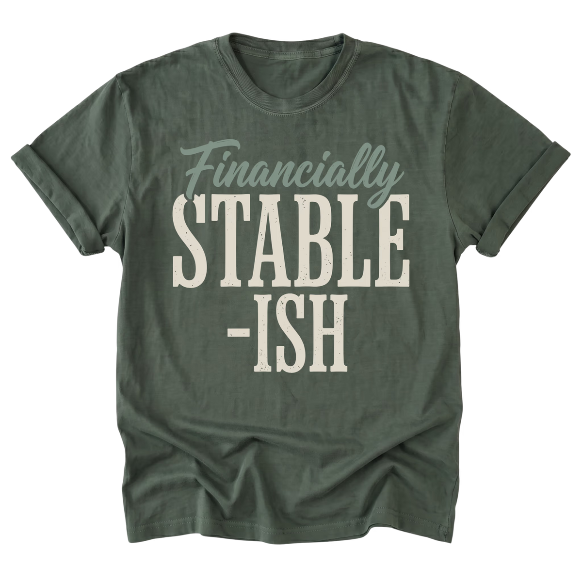 A military green short-sleeve t-shirt with a distressed graphic print reading 'Financially STABLE -ISH' on the front, displayed against a solid white background.