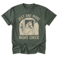 A military green short-sleeve t-shirt with a graphic print of a horse in a stable door and the text 'JUST ONE MORE NIGHT CHECK' in a light beige color, displayed on a solid white background.