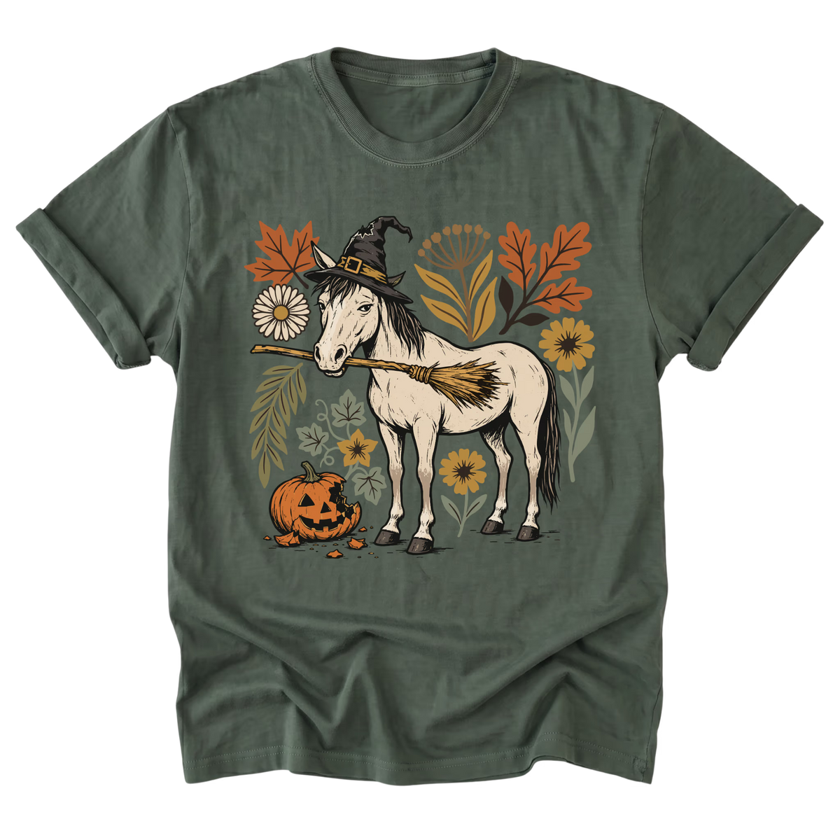 An military green short-sleeve t-shirt with a graphic of a white horse wearing a witch hat and holding a broom, surrounded by autumn leaves, flowers, and a jack-o'-lantern pumpkin.