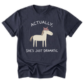 A navy blue short-sleeve t-shirt with a graphic of a cartoon horse wearing a pink crown, accompanied by the text 'ACTUALLY, SHE'S JUST DRAMATIC' in white.