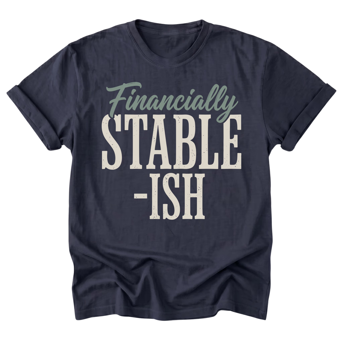A navy blue short-sleeve t-shirt with a graphic print reading 'Financially STABLE -ISH' in cream and sage green text, displayed on a clean white background.