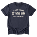 A navy blue short-sleeve t-shirt with rolled-up sleeves, featuring the text 'I JUST WANNA GO TO THE BARN AND IGNORE PEOPLE' printed in a distressed cream-colored font on the front, displayed against a solid white background.
