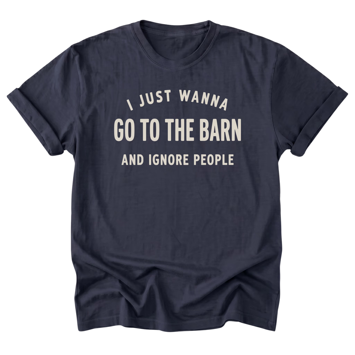 A navy blue short-sleeve t-shirt with rolled-up sleeves, featuring the text 'I JUST WANNA GO TO THE BARN AND IGNORE PEOPLE' printed in a distressed cream-colored font on the front, displayed against a solid white background.