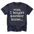 A navy blue short-sleeve t-shirt with the phrase 'oops, I bought another horse.