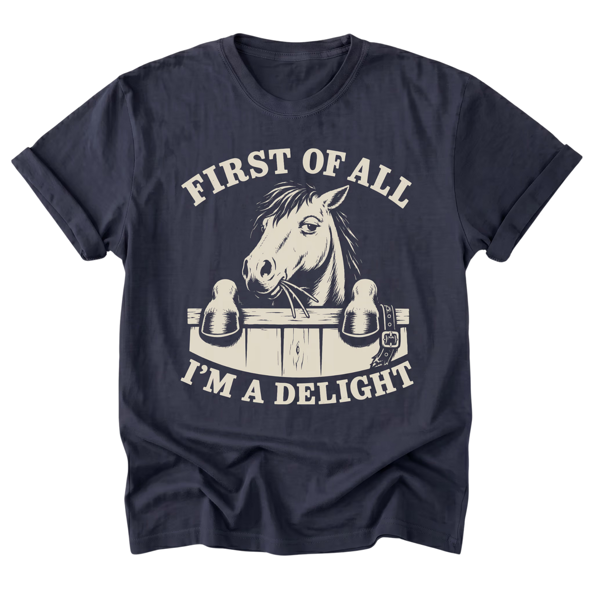 A navy blue short-sleeve t-shirt with a cream-colored graphic print of a horse head and the text 'FIRST OF ALL I'M A DELIGHT' on a solid white background.
