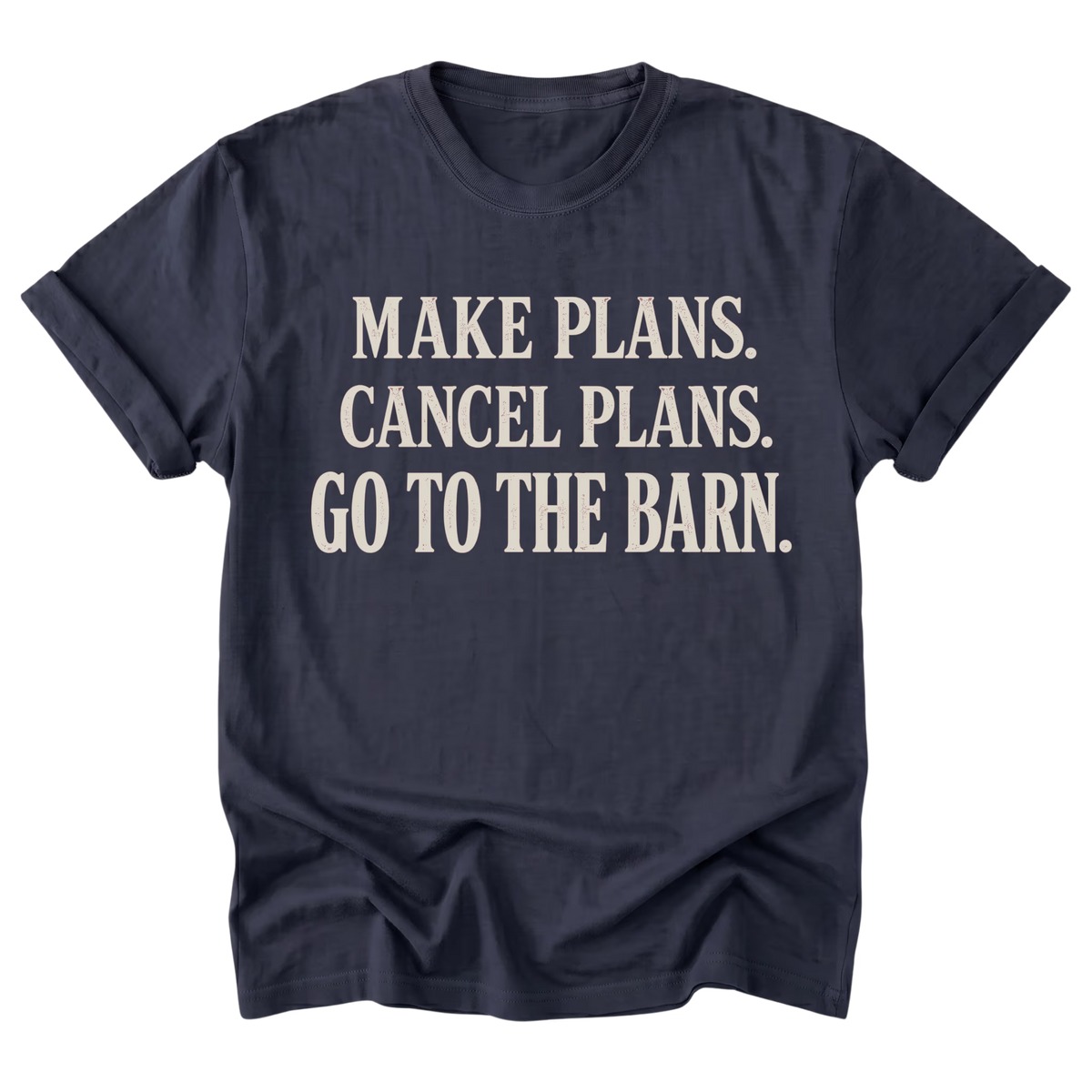 A navy blue short-sleeve t-shirt with rolled cuffs, featuring the text 'MAKE PLANS. CANCEL PLANS.