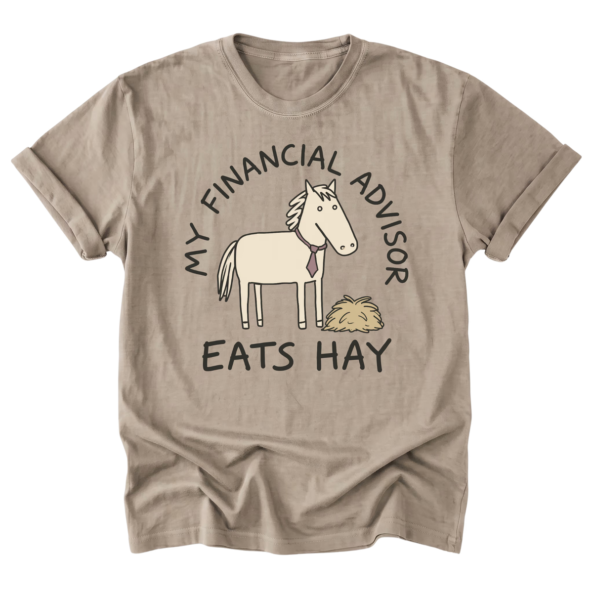 A sand beige graphic t-shirt featuring a cartoon illustration of a white horse wearing a purple tie next to a pile of hay, with the text 'MY FINANCIAL ADVISOR EATS HAY' printed around the graphic.