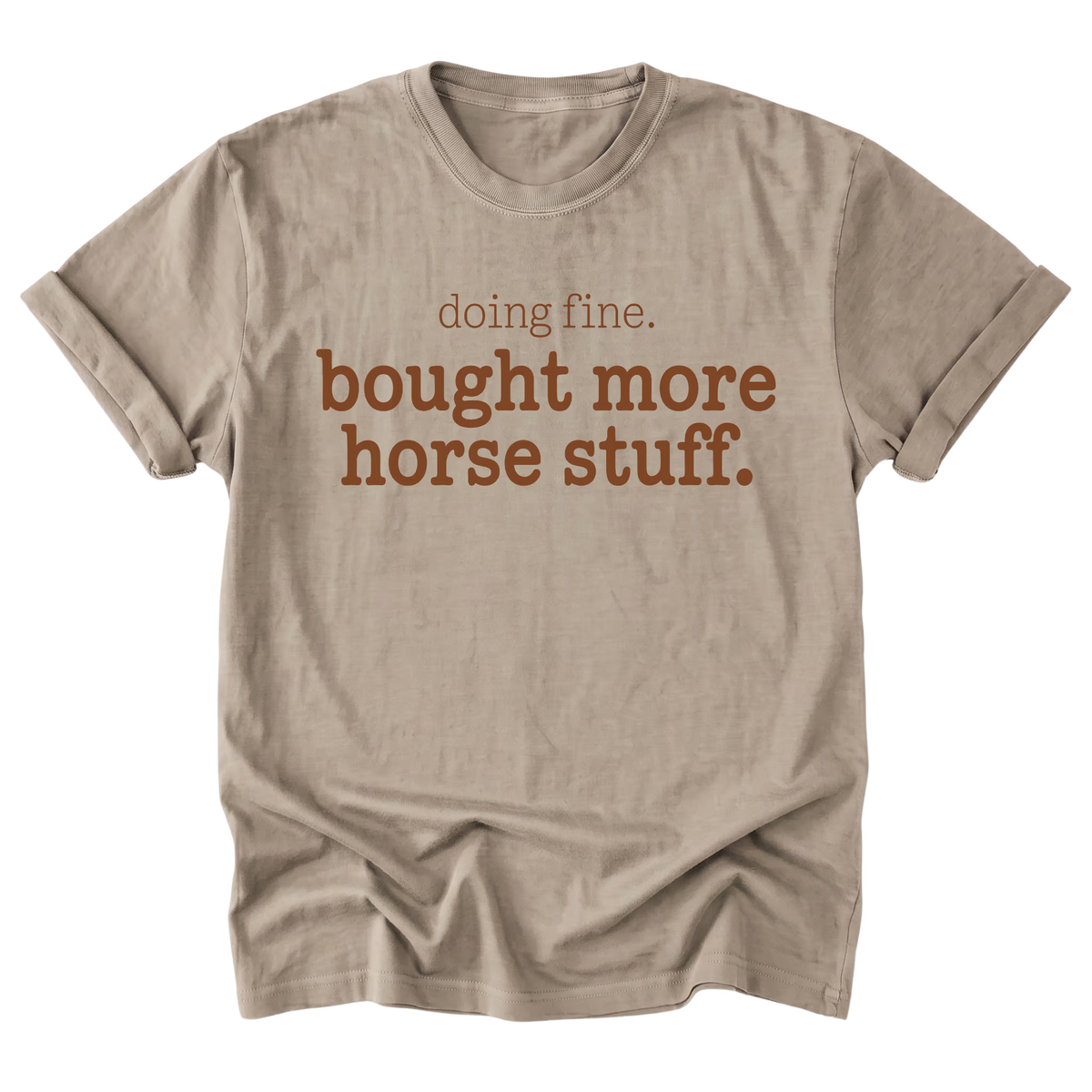 A light sand brown everyday tee featuring the Doing Fine, Bought More Horse Stuff design on the front by Barnarchy.