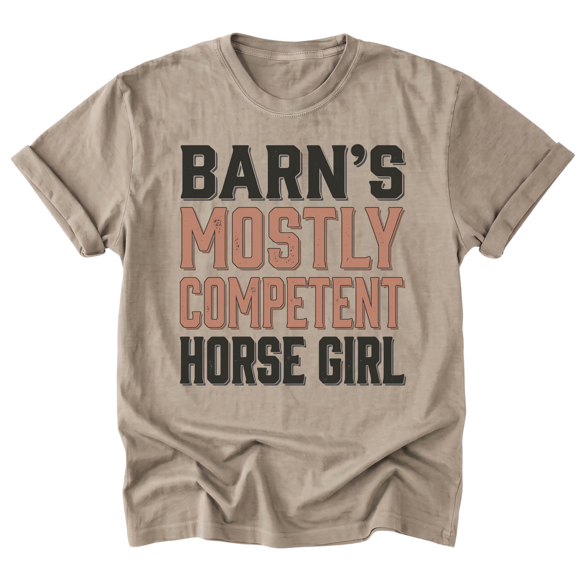 A light sand brown short-sleeve t-shirt with a distressed typographic graphic reading 'BARN'S MOSTLY COMPETENT HORSE GIRL' in cream and muted terracotta colors, displayed on a solid white background.