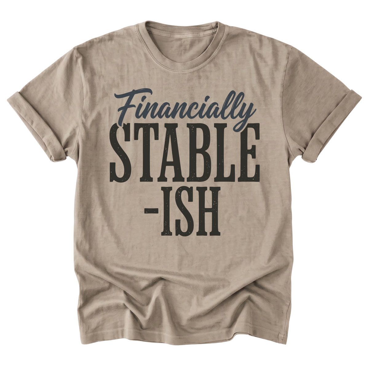 A sand beige short-sleeve t-shirt with a graphic print reading 'Financially STABLE -ISH' in cream and sage green text, displayed on a clean white background.