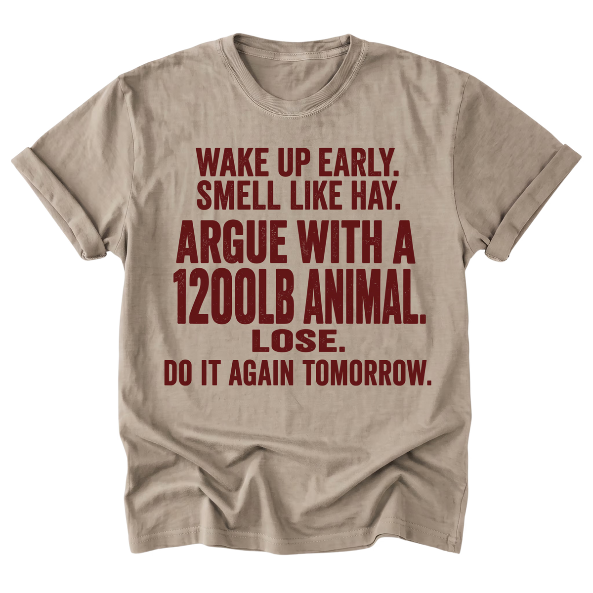 A beige sand crewneck t-shirt with a humorous text graphic printed in dark red. The text reads: 'WAKE UP EARLY.