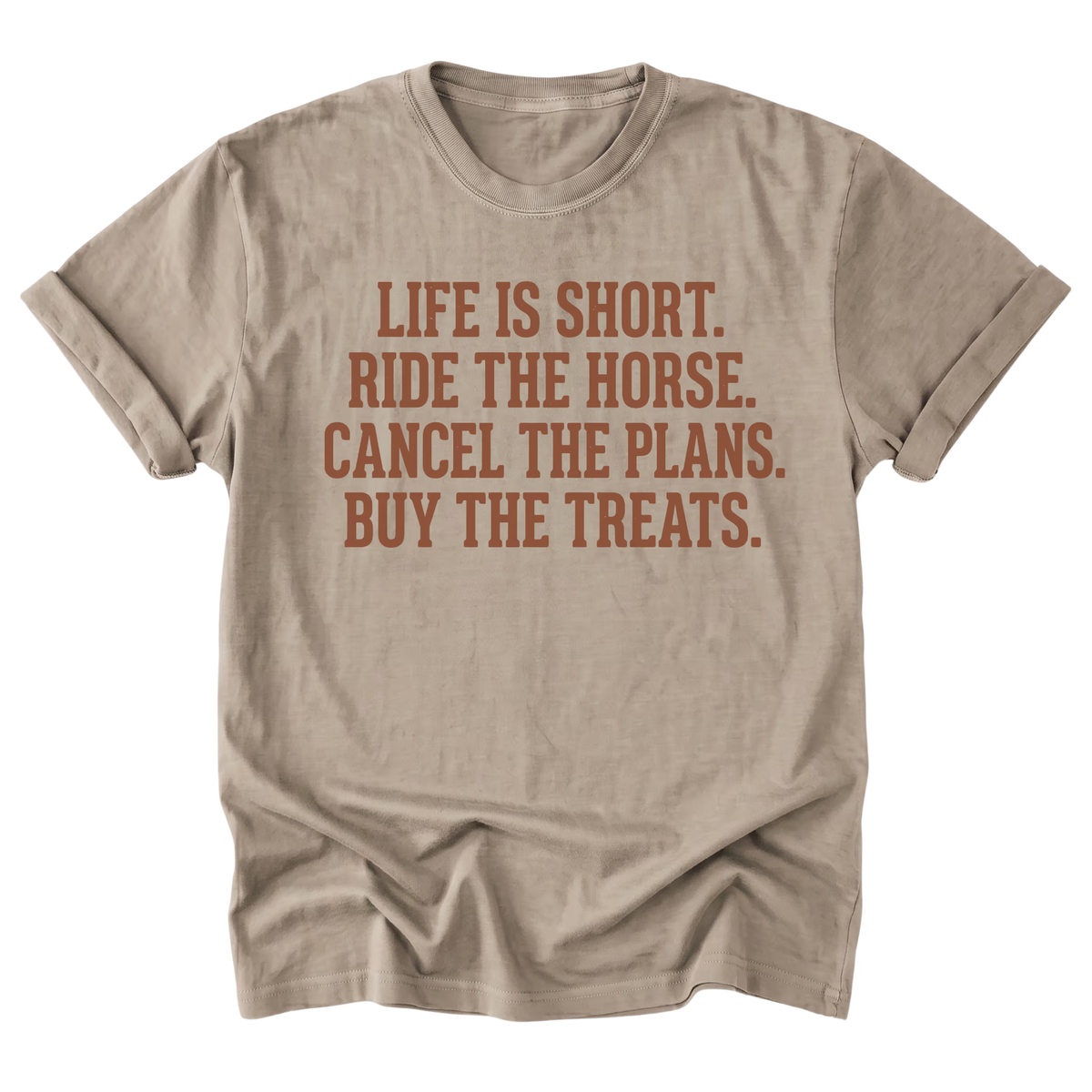A sand beige crewneck t-shirt with a distressed brown text graphic that reads 'LIFE IS SHORT. RIDE THE HORSE.